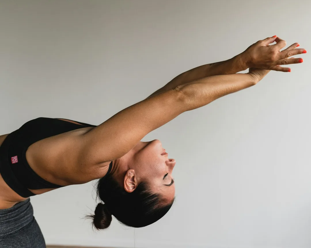 Athlete stretching in a calm studio